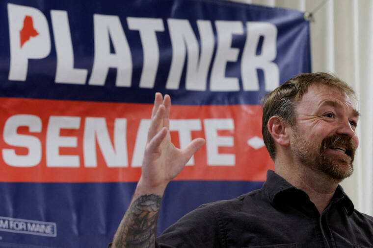 REUTERS/BRIAN SNYDER
                                Democratic candidate for U.S. Senate Graham Platner speaks at a campaign town hall meeting in Portland, Maine.