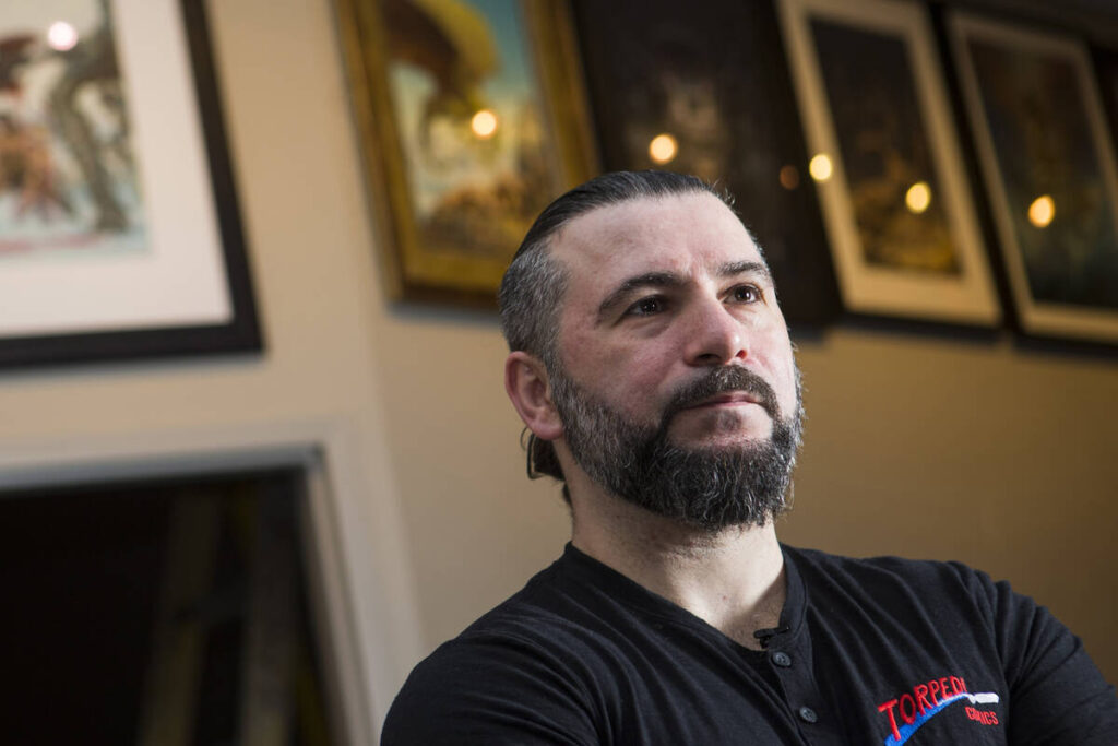 System of a Down's John Dolmayan poses inside his Torpedo Comics shop ahead of its opening ...