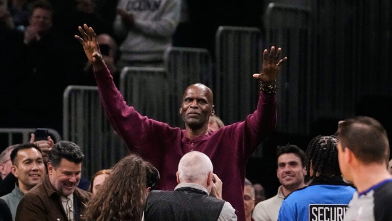 Hall of Fame center and former Boston Celtic Robert Parrish acknowledges fans during the first half of an NBA basketball game against the Golden State Warriors, Wednesday, March 18, 2026, in Boston.