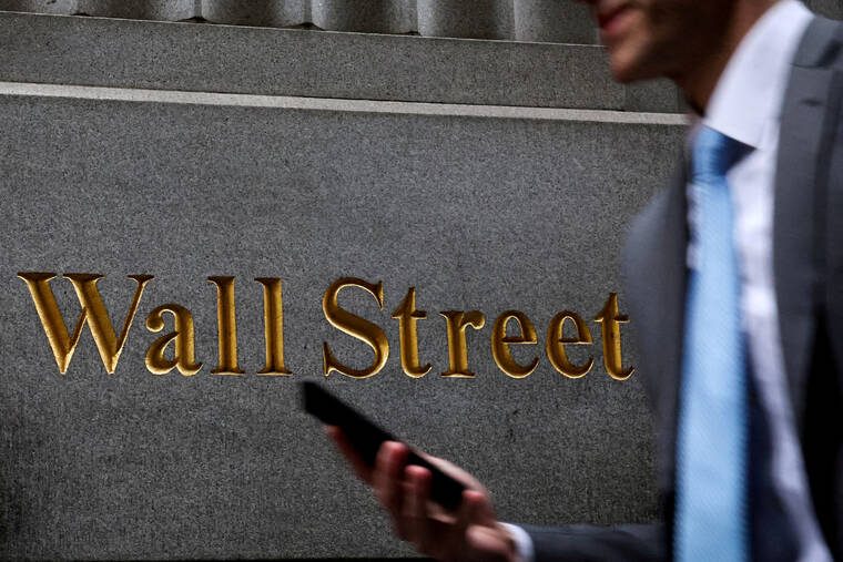 Wall Street ends mixed as investors focus on tech earnings