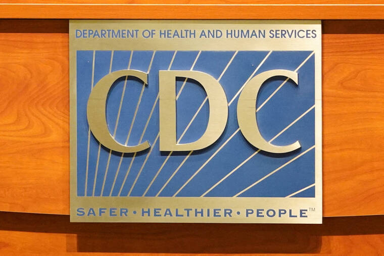 REUTERS/MEGAN VARNER/FILE PHOTO
                                A sign of the Centers for Disease Control and Prevention is seen on a podium during the meeting of the Advisory Committee on Immunization Practices in Atlanta, Ga., in June 2025. Two people have died from cyclosporiasis in Michigan, the states health department said today, marking the first fatalities in the largest U.S. outbreak of the intestinal illness.