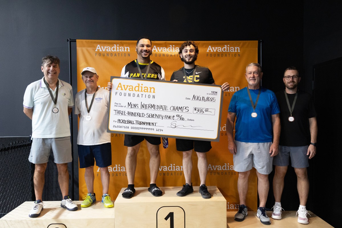 Pickleball for a Purpose 2026: what to know about the Aug. 23 tournament 6 Men's Intermediate Division champions hold a $375 Avadian Foundation championship check on the podium, flanked by silver and bronze medalists