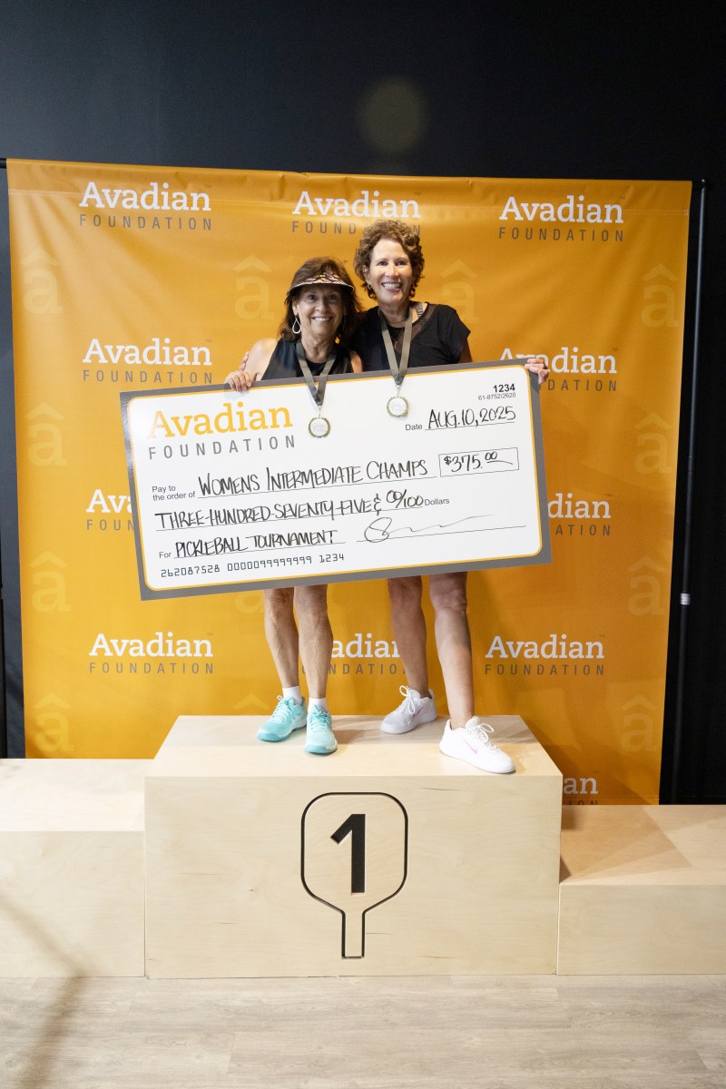 Pickleball for a Purpose 2026: what to know about the Aug. 23 tournament 9 Two women stand on the first-place podium holding an Avadian Foundation championship check for $375 made out to Women's Intermediate Champs