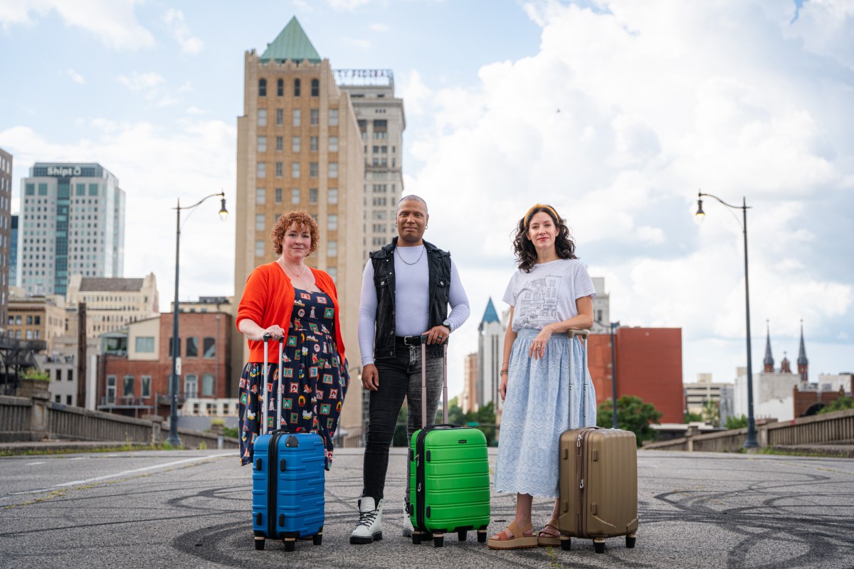 47 September Events: Birmingham Artwalk, Southbound Food Festival + more 2 Three travelers standing on a city street, each with a hardshell rolling suitcase in blue, green, and gold, with a downtown skyline behind them
