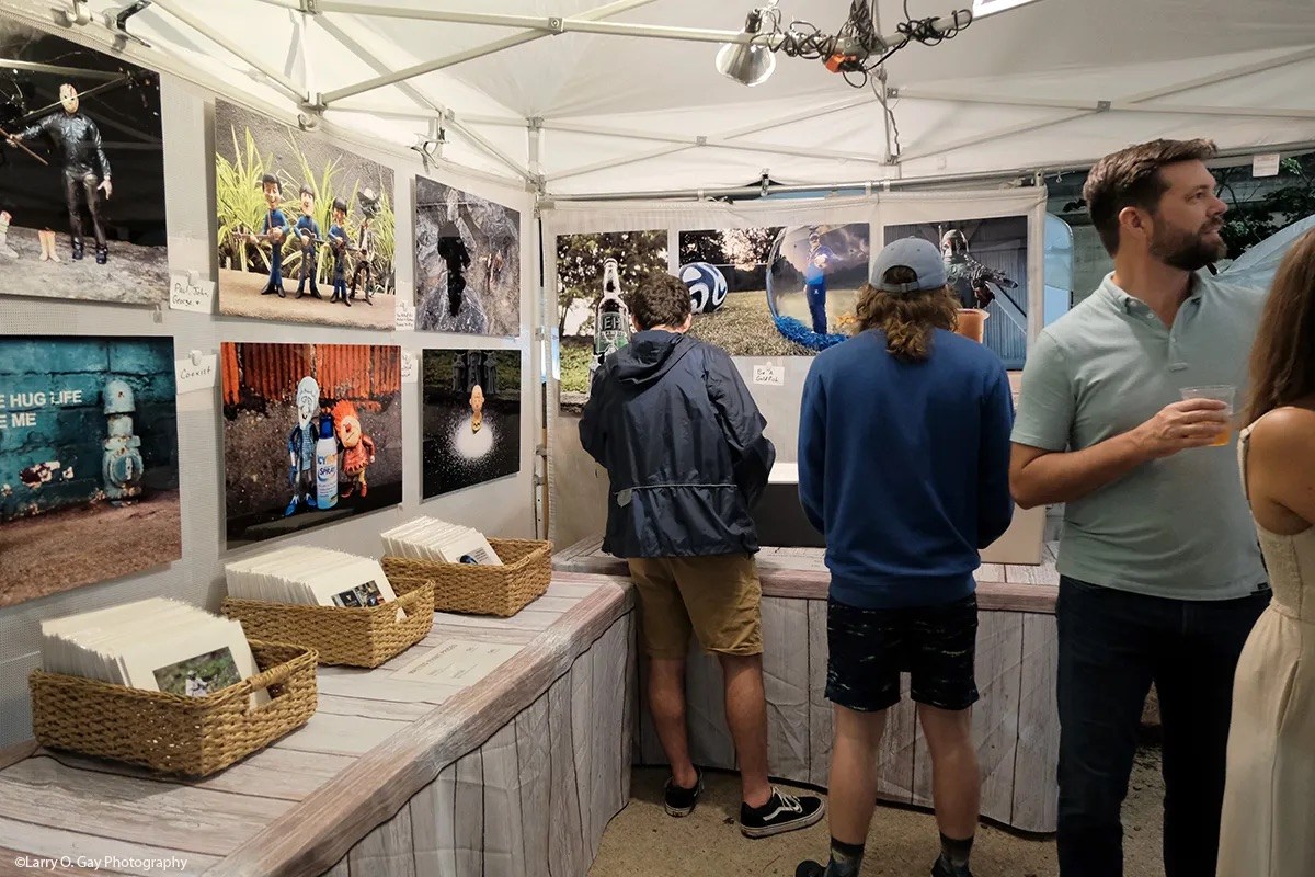 47 September Events: Birmingham Artwalk, Southbound Food Festival + more 3 people browsing artwork at a vendor booth