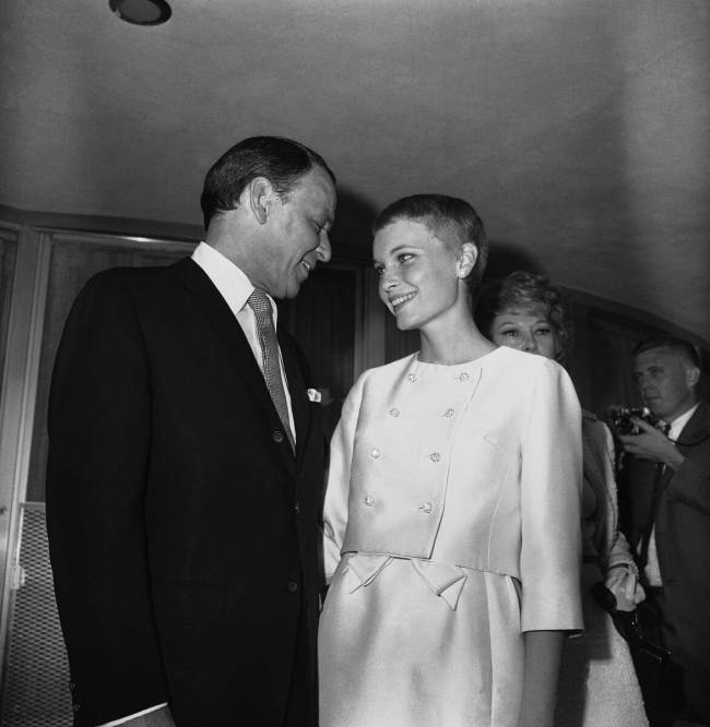 Frank Sinatra and Mia Farrow smiles fondly at each other outside the Sands Hotel suite where th ...