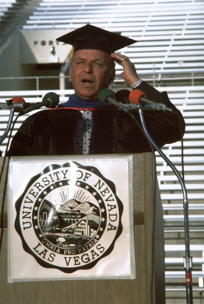 Frank Sinatra speaks at a commencement ceremony in which he received an honorary doctorate from ...