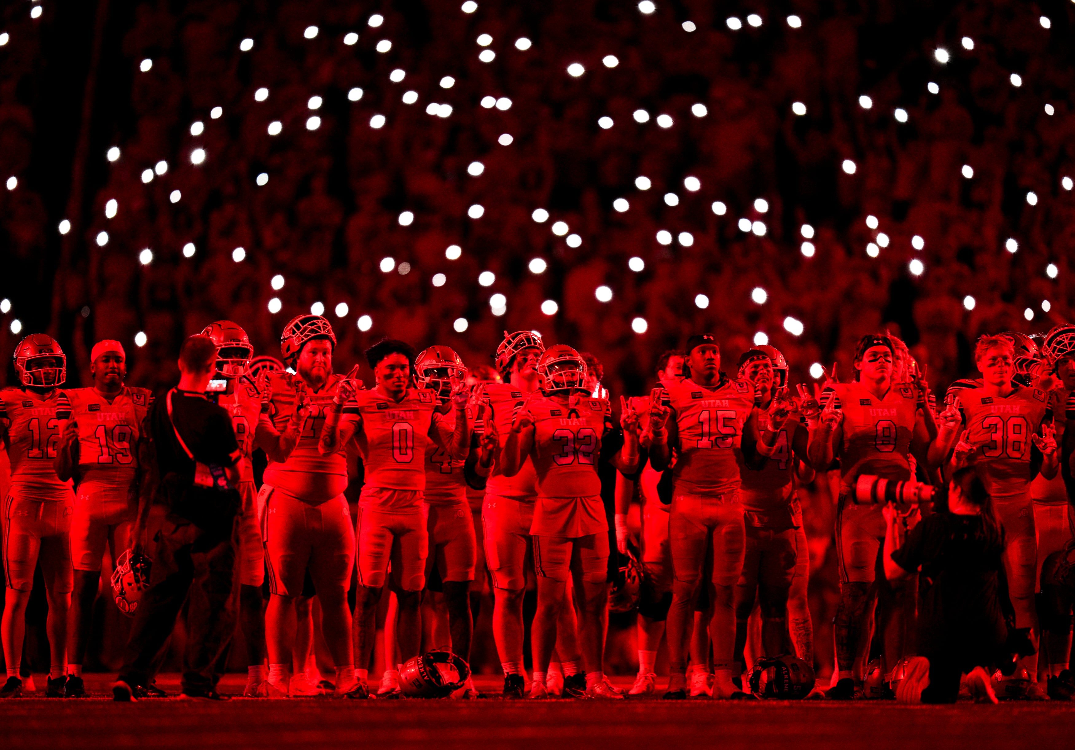 (Bethany Baker  |  The Salt Lake Tribune) Utah Utes stand in silence after the third quarter of the game between the Utah Utes and the Arkansas Razorbacks in Salt Lake City on Saturday, Sept. 12, 2026.