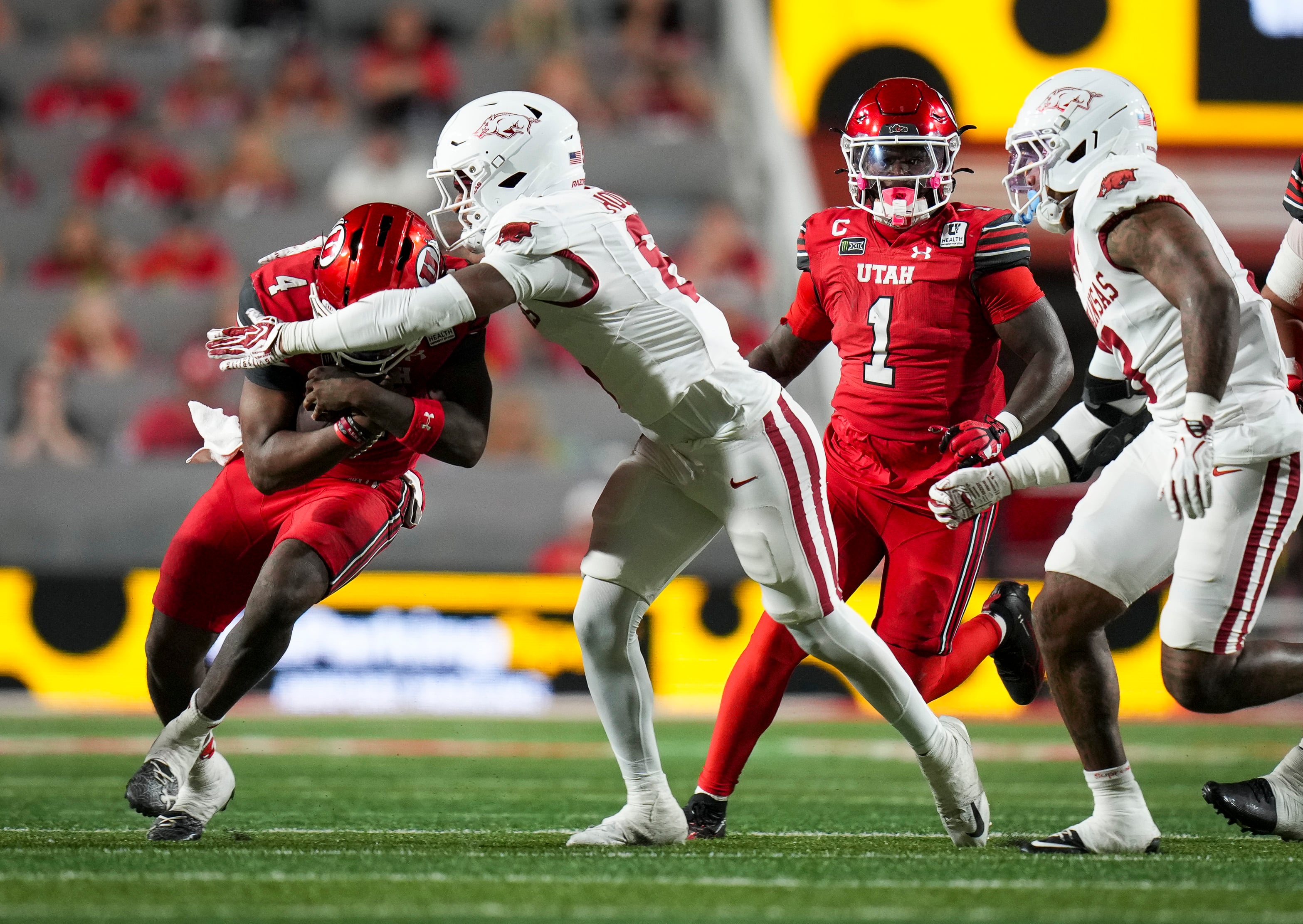 (Bethany Baker  |  The Salt Lake Tribune) Arkansas Razorbacks linebacker Phoenix Jackson (8) tackles Utah Utes quarterback Devon Dampier (4) during the game between the Utah Utes and the Arkansas Razorbacks in Salt Lake City on Saturday, Sept. 12, 2026.