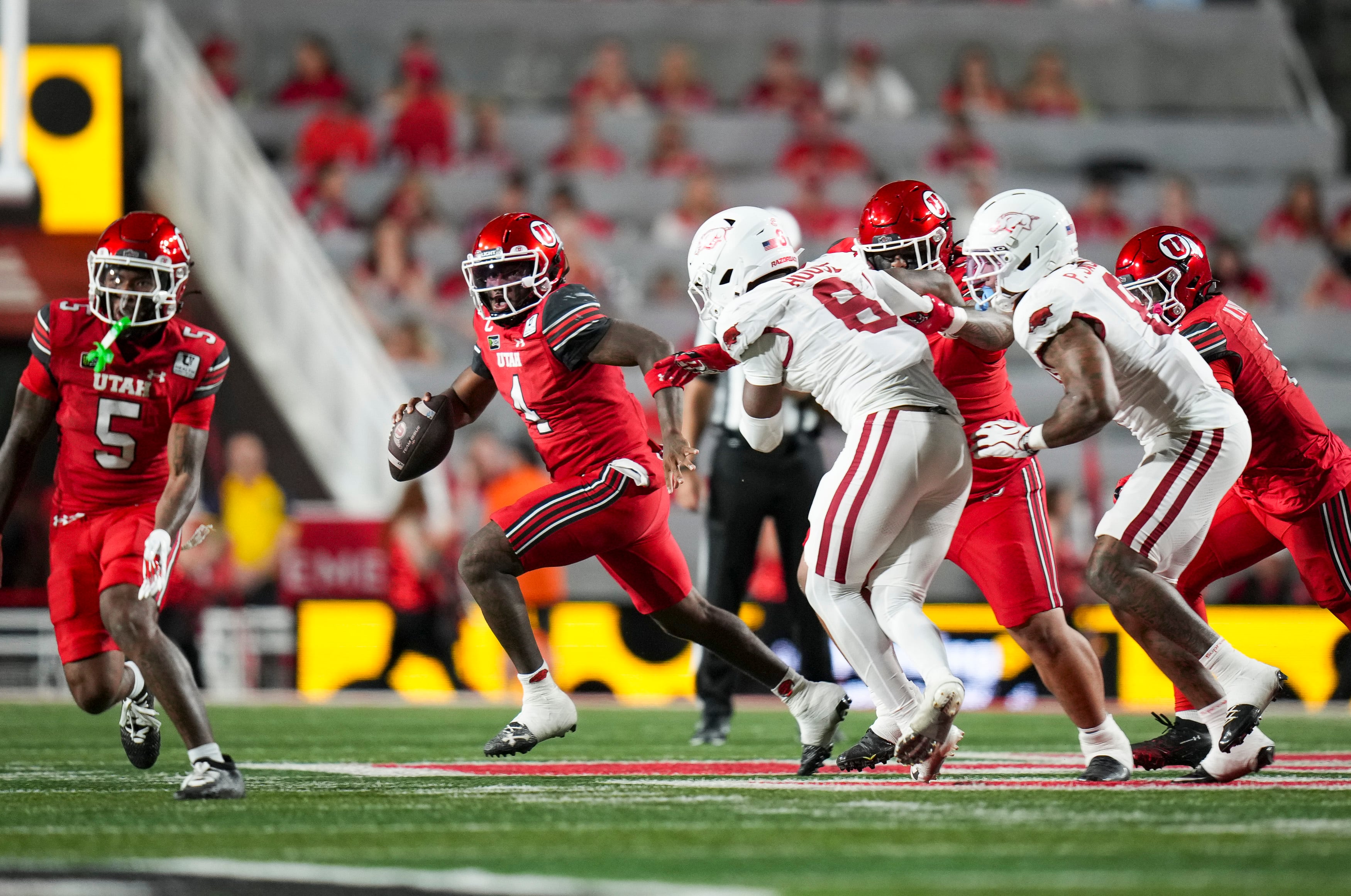 (Bethany Baker  |  The Salt Lake Tribune) Utah Utes quarterback Devon Dampier (4) looks to throw during the game between the Utah Utes and the Arkansas Razorbacks in Salt Lake City on Saturday, Sept. 12, 2026.