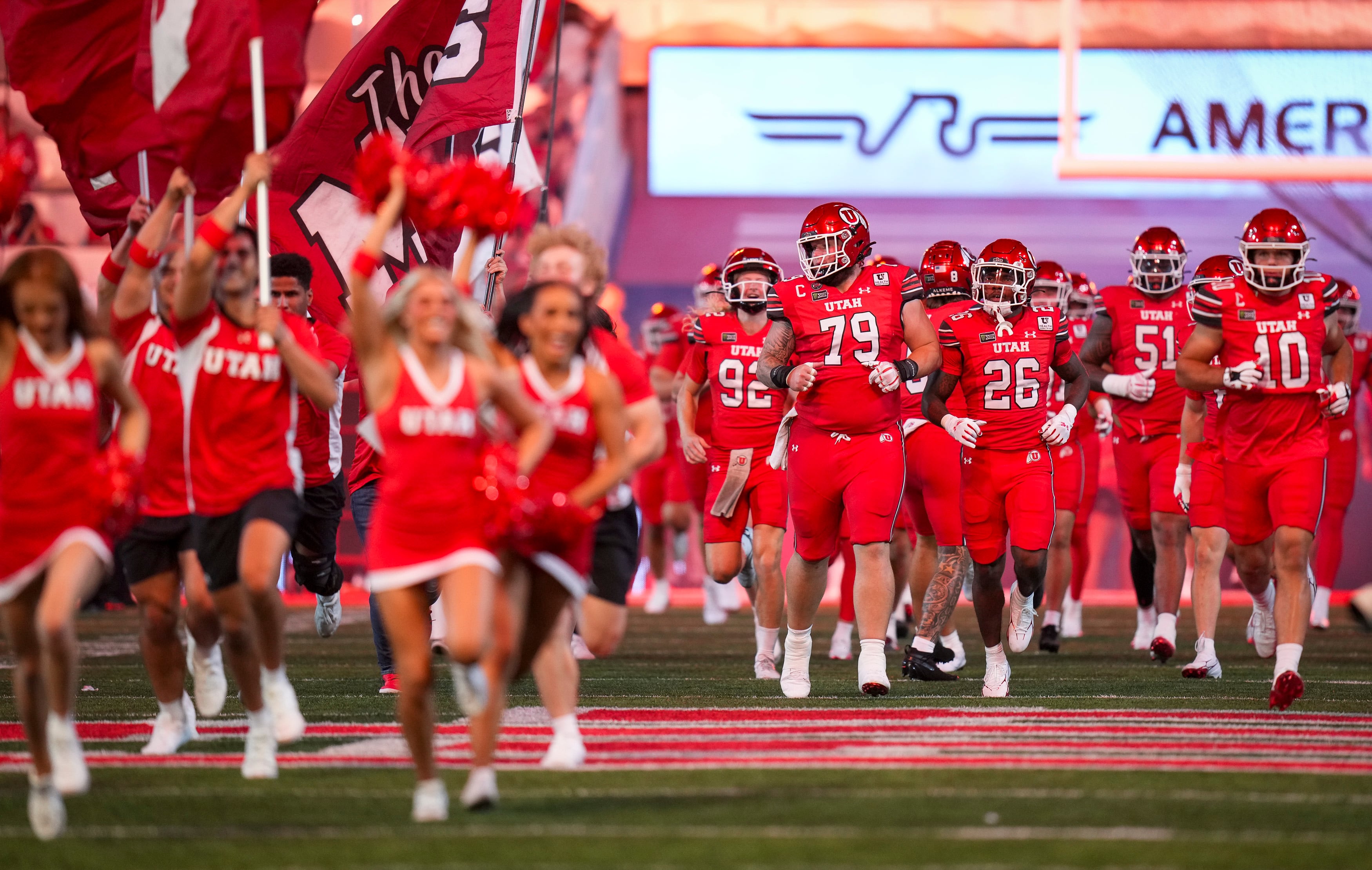 (Bethany Baker  |  The Salt Lake Tribune) Utah Utes run onto the field before the game between the Utah Utes and the Arkansas Razorbacks in Salt Lake City on Saturday, Sept. 12, 2026.