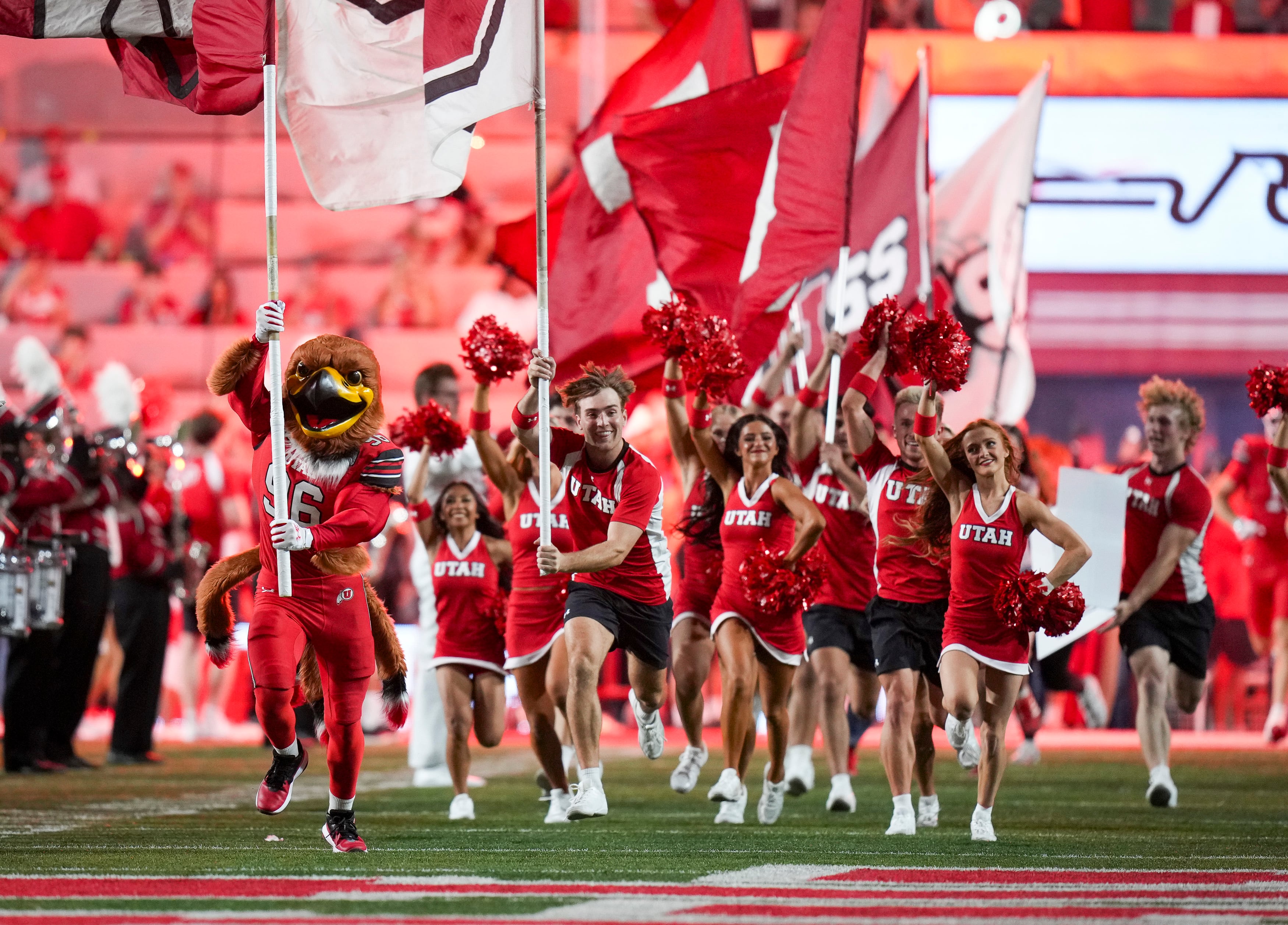 (Bethany Baker  |  The Salt Lake Tribune) Utah Utes cheer team runs onto the field before the game between the Utah Utes and the Arkansas Razorbacks in Salt Lake City on Saturday, Sept. 12, 2026.