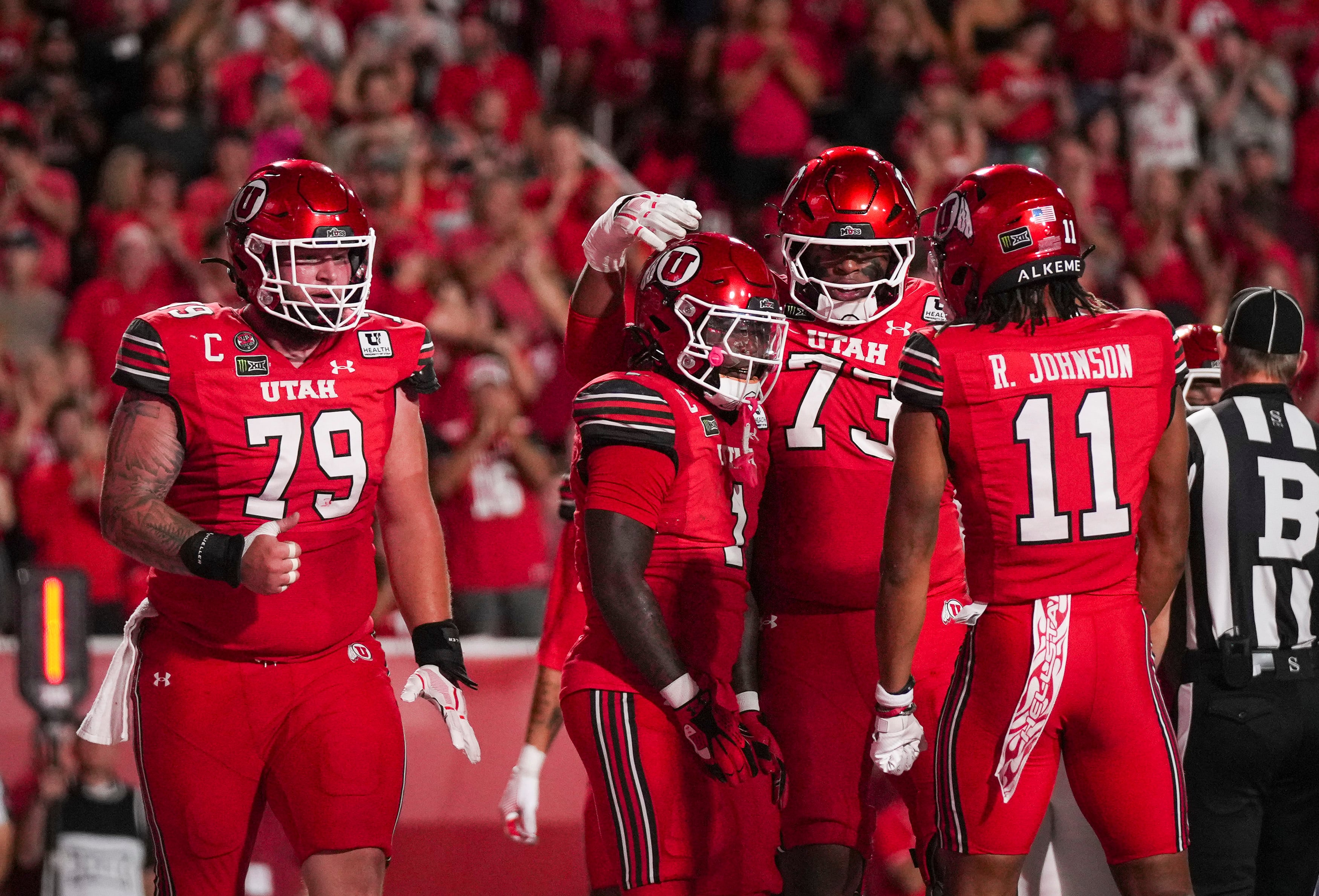 (Bethany Baker  |  The Salt Lake Tribune) Utah Utes celebrate a touchdown during the game between the Utah Utes and the Arkansas Razorbacks in Salt Lake City on Saturday, Sept. 12, 2026.