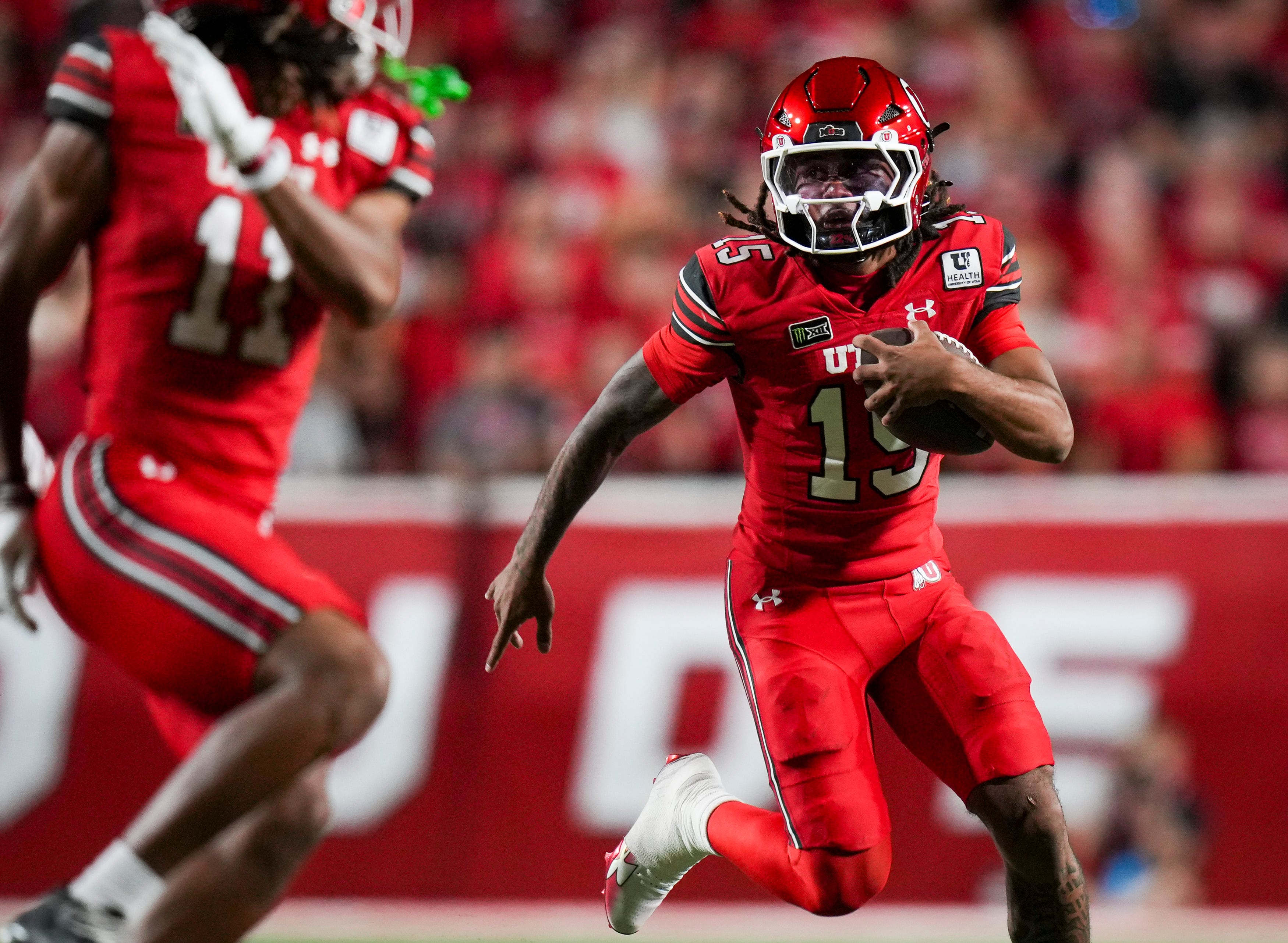 (Bethany Baker  |  The Salt Lake Tribune) Utah Utes quarterback Byrd Ficklin (15) runs the ball during the game between the Utah Utes and the Arkansas Razorbacks in Salt Lake City on Saturday, Sept. 12, 2026.