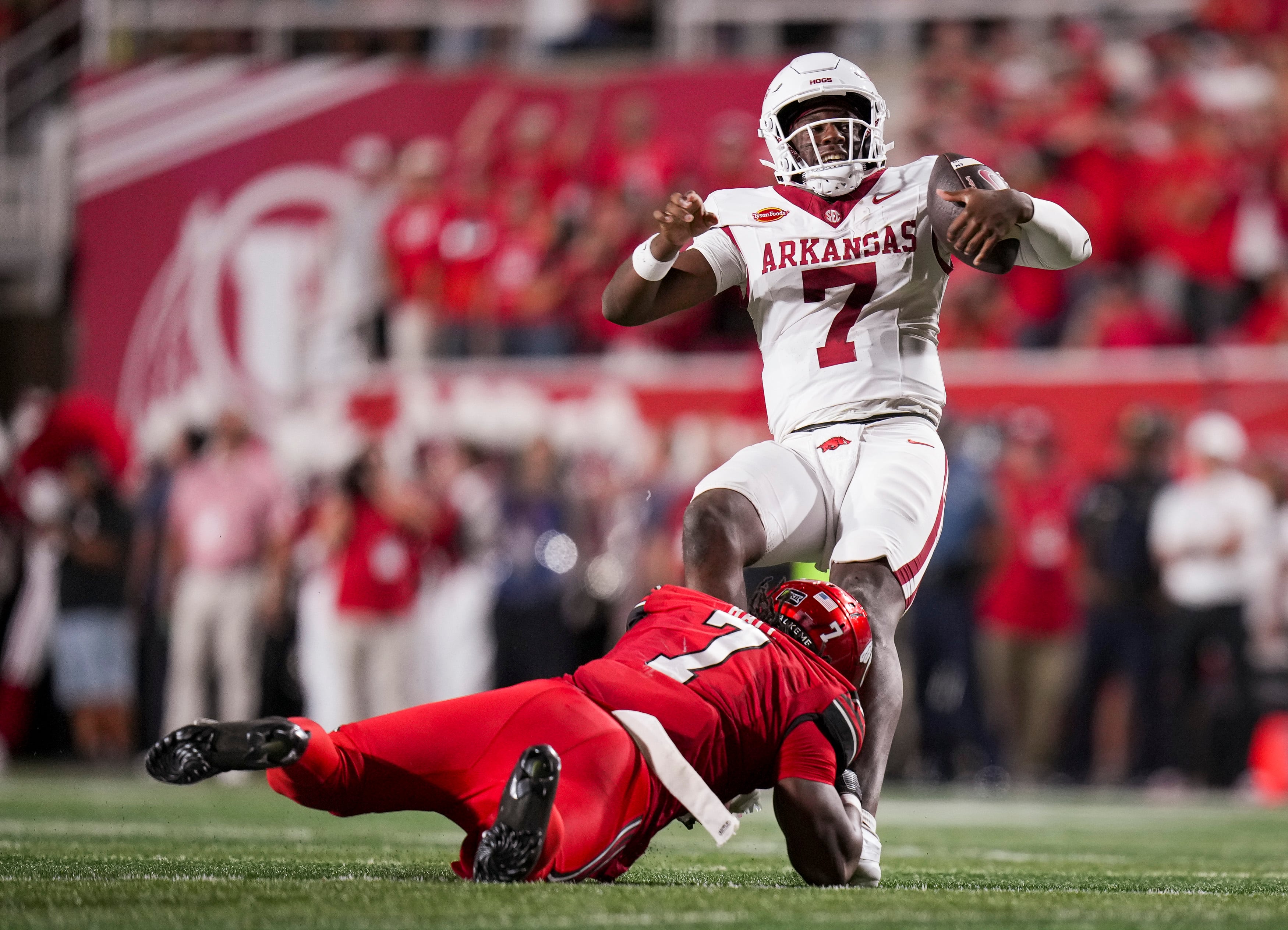(Bethany Baker  |  The Salt Lake Tribune) Utah Utes linebacker Johnathan Hall (7) tackles Arkansas Razorbacks quarterback KJ Jackson (7) during the game between the Utah Utes and the Arkansas Razorbacks in Salt Lake City on Saturday, Sept. 12, 2026.