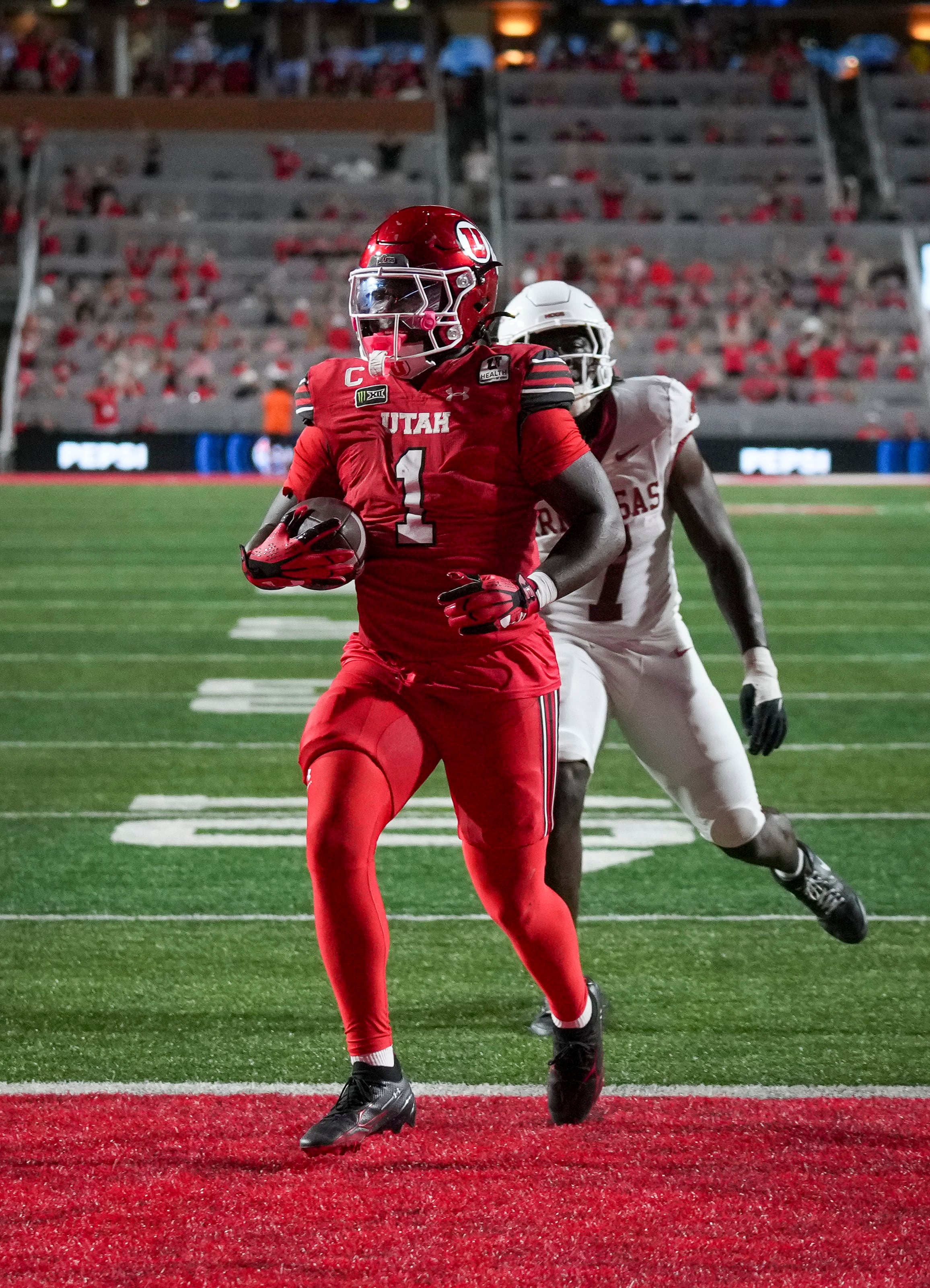(Bethany Baker  |  The Salt Lake Tribune) Utah Utes running back Wayshawn Parker (1) runs the ball in for a touchdown during the game between the Utah Utes and the Arkansas Razorbacks in Salt Lake City on Saturday, Sept. 12, 2026.