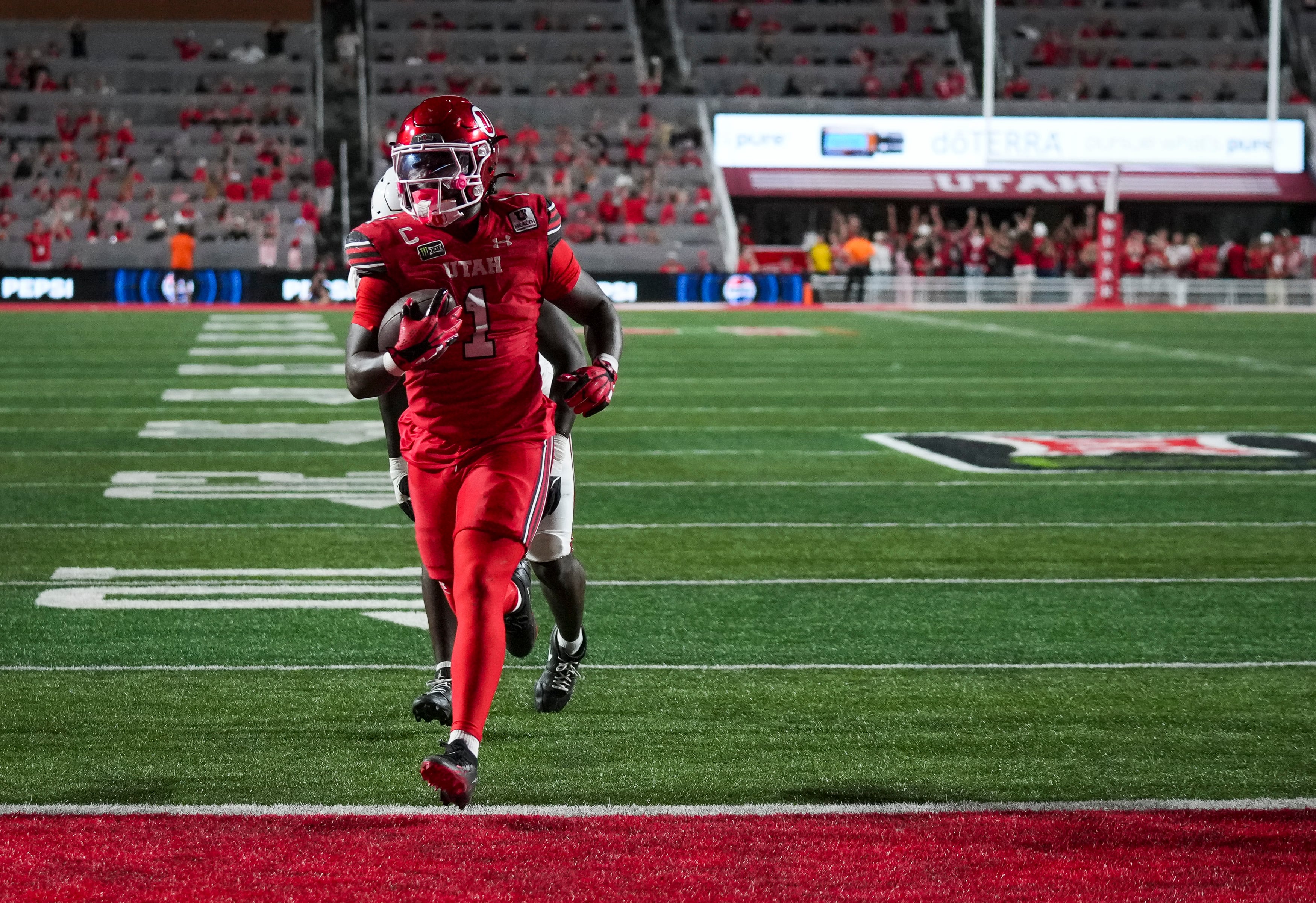 (Bethany Baker  |  The Salt Lake Tribune) Utah Utes running back Wayshawn Parker (1) runs the ball in for a touchdown during the game between the Utah Utes and the Arkansas Razorbacks in Salt Lake City on Saturday, Sept. 12, 2026.