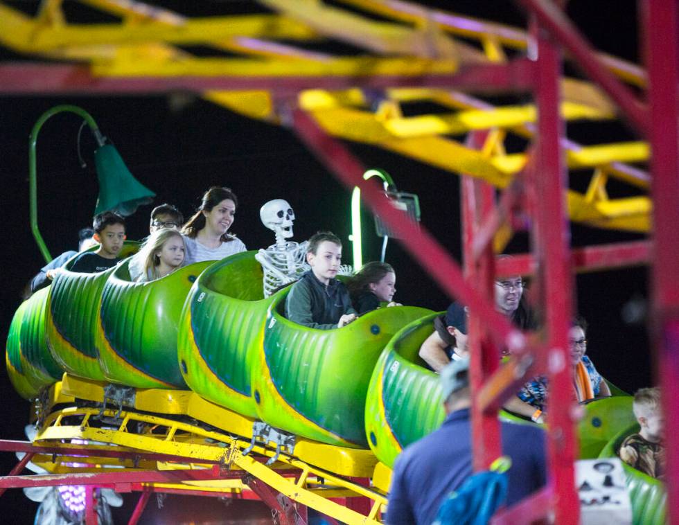 Attendees enjoy the Wacky Worm Coaster at HallOVeen. (Benjamin Hager Las Vegas Review-Journal)