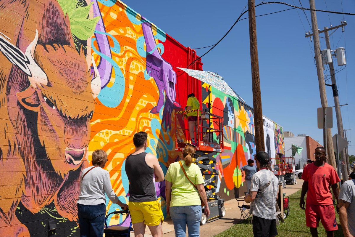 30+ new murals will come to life at FREE Yonder Walls Festival—Oct. 17, 2026 2 people watching artist working on mural