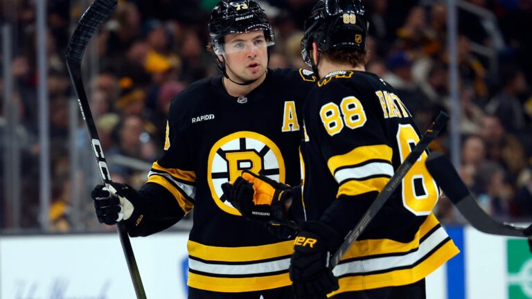 Charlie McAvoy (left) is no offensive David Pastrnak, but he does lead Bruins defenseman with 11 goals and 47 assists.