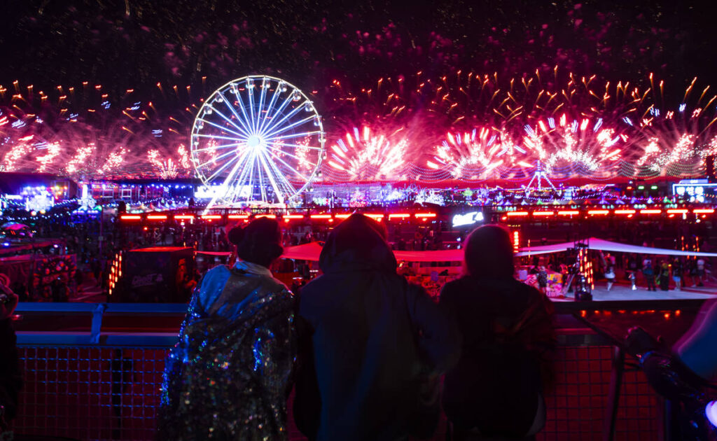 Attendees watch as fireworks go off during the final night of the Electric Daisy Carnival at La ...