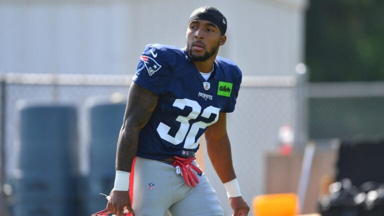 New England Patriots running back Treveyon Henderson (32) steps on the field for a joint NFL football practice with the Philadelphia Eagles, Wednesday, Aug. 19, 2026, in Foxborough, Mass.
