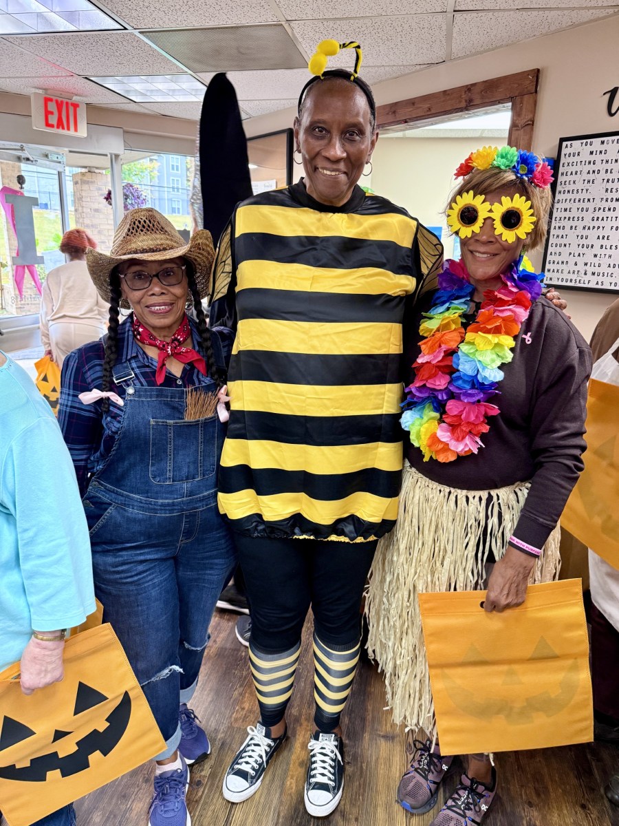 People in halloween costumes standing together
