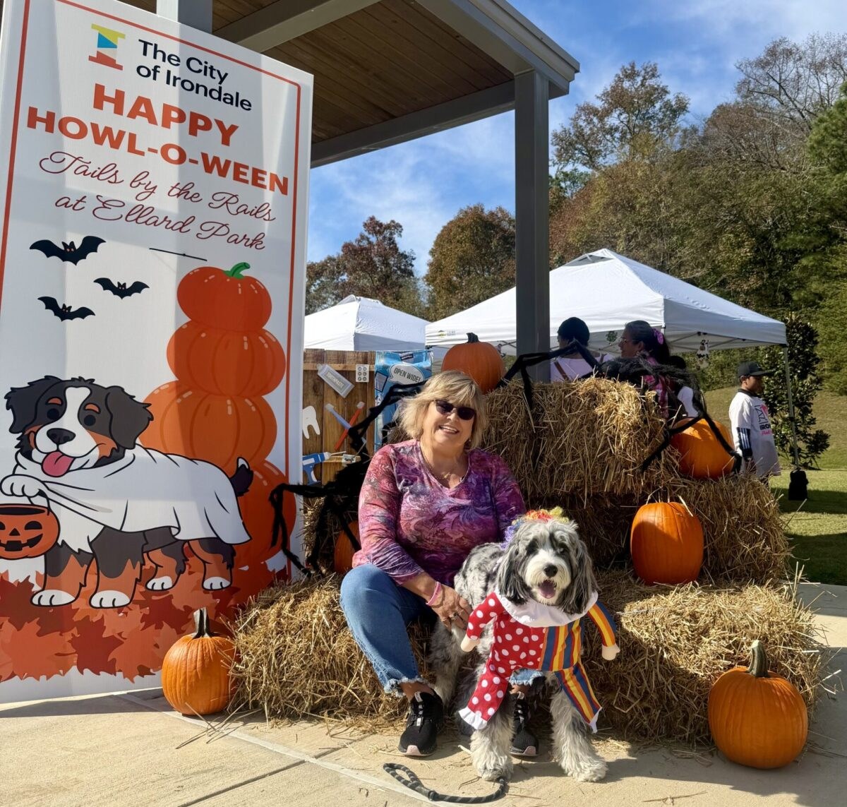 People and dogs in halloween costumes