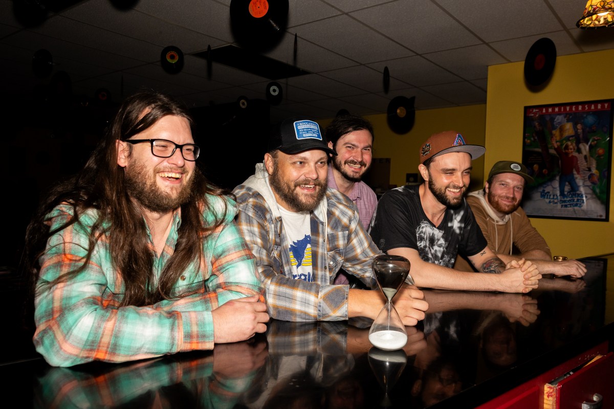 Winston ramble band sitting at a bar