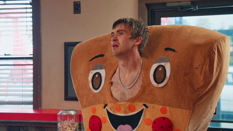 Netflix Minimum Wage a young man wearing a pizza mascot costume